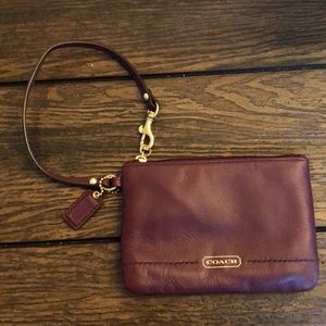 Burgundy coach wristlet